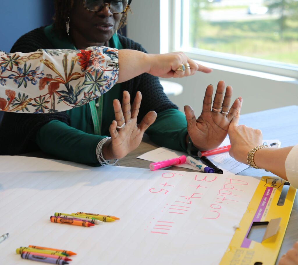 women holding up hands 1024x911